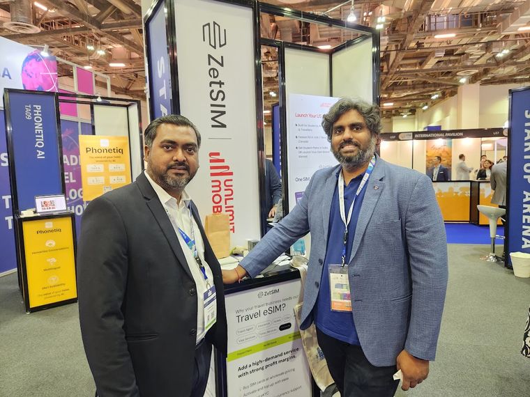 Conversation at a travel eSIM exhibitor stand at Travel Tech Asia 2025