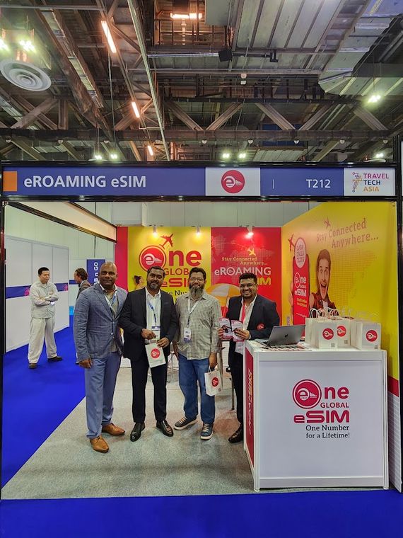 Group photograph at an exhibitor stand at Travel Tech Asia 2025
